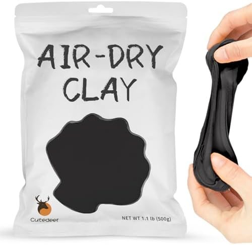 Sealed bag of Cutedeer black air dry clay with small black modelled details
